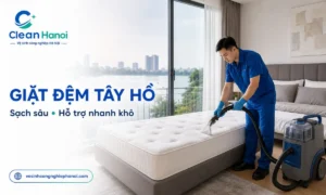 nhân viên vệ sinh đệm trong không gian căn hộ tại Tây Hồ, sử dụng thiết bị phun hút để làm sạch bề mặt và thu hồi dung dịch dư.